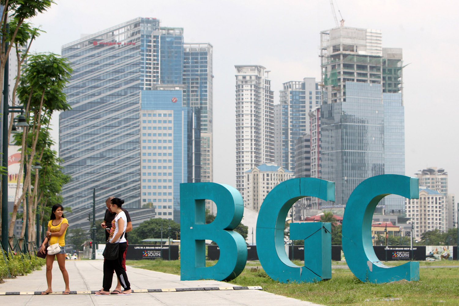 People walk at the sprawling Bonifacio Global City (BGC)
